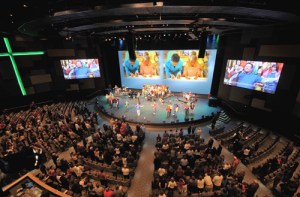 Loud music, monster-sized video screens, all in multiple locations. Is this the future of church?